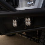 WeldTec Designs Sentinel front bumper installed on a Ford F-550/F-600 Forest River Super C RV with off-road tires, auxiliary LED lighting, and integrated winch.