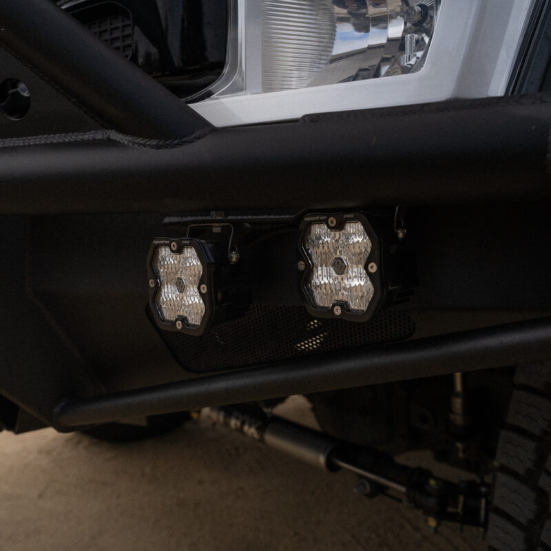 WeldTec Designs Sentinel front bumper installed on a Ford F-550/F-600 Forest River Super C RV with off-road tires, auxiliary LED lighting, and integrated winch.