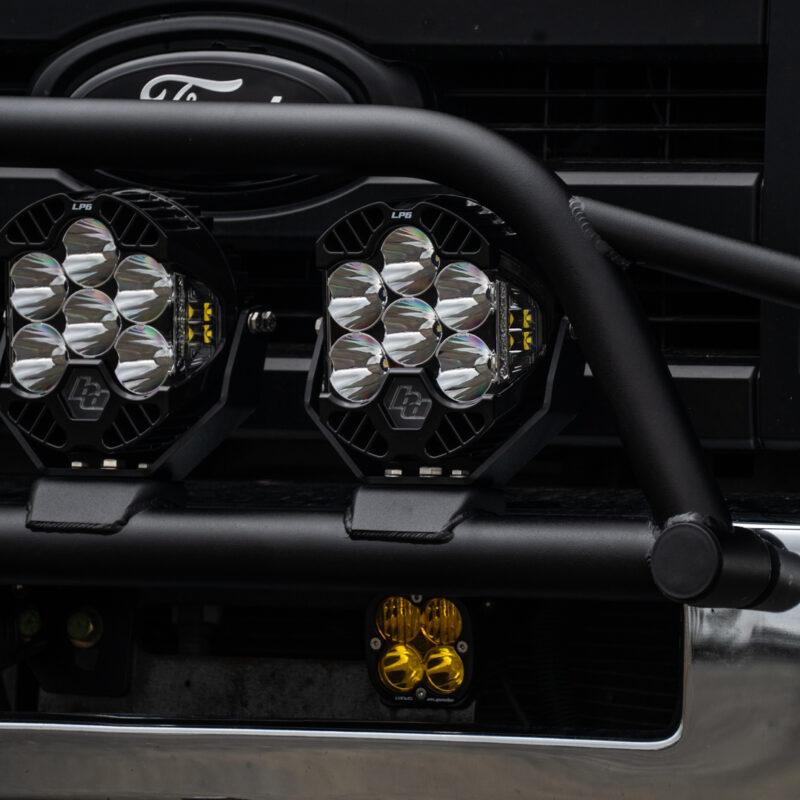 WeldTec Designs Ford E-Series Light Bar Prerunner mounted on a factory chrome bumper with three LED auxiliary lights.