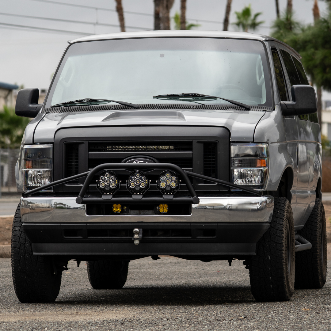 WeldTec Designs Ford E-Series Light Bar Prerunner mounted on a factory chrome bumper with three LED auxiliary lights.